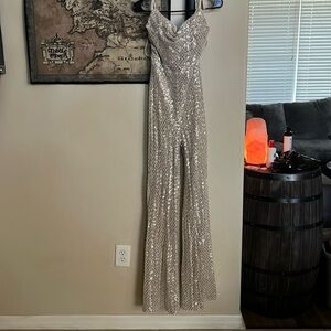 Disco style, sparky jumpsuit NEVER WORN. Corset tie back.